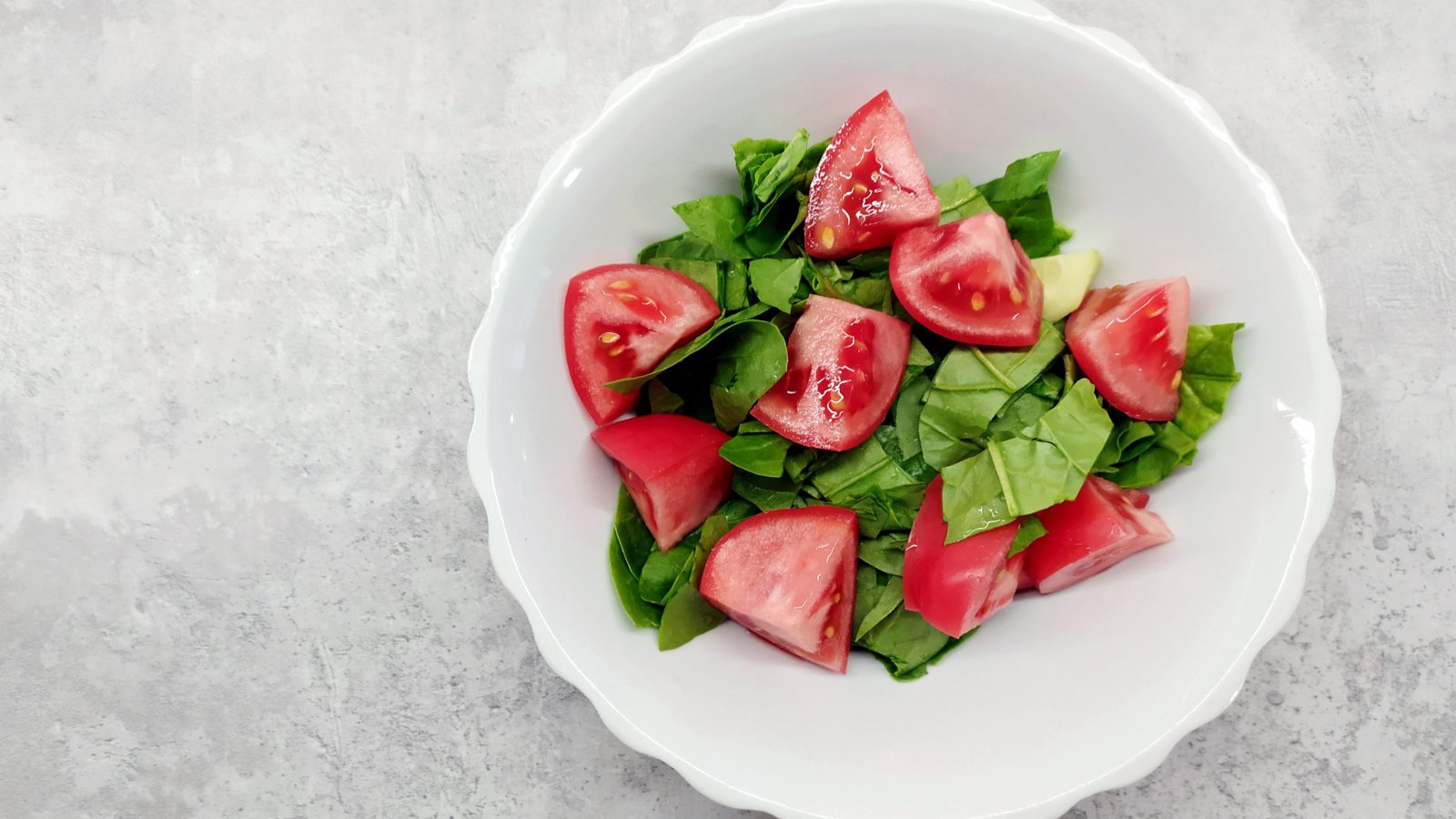 A dish garnished with tomatoes and microgreens grown using a hydroponic system